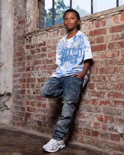 Kid modeling Saucony running shoes