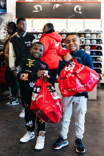 Kids with City Gear shopping backs at in-store event
