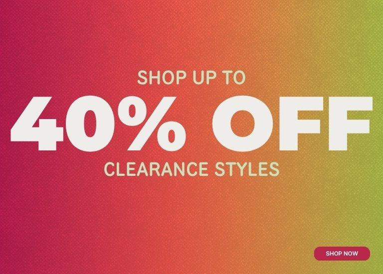 A promotional banner featuring a vibrant pink, orange, and yellow gradient background with a subtle halftone texture. Centered text in bold white and gold reads, "SHOP UP TO 40% OFF CLEARANCE STYLES." A small pink "SHOP NOW" button is located in the bottom right corner.