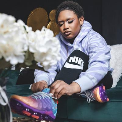 Makayla Monet tying Vapormax shoe