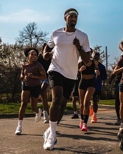 Man running with people behind him