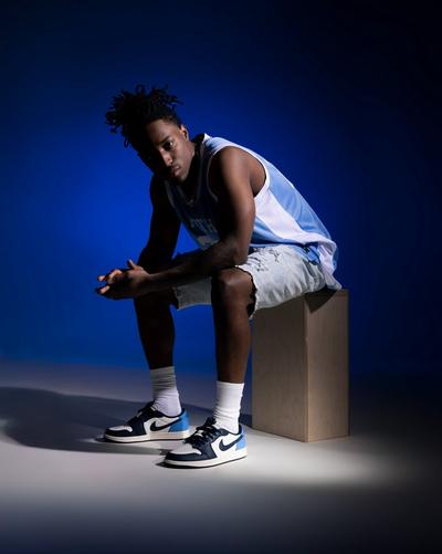 man-sitting-in-jordans