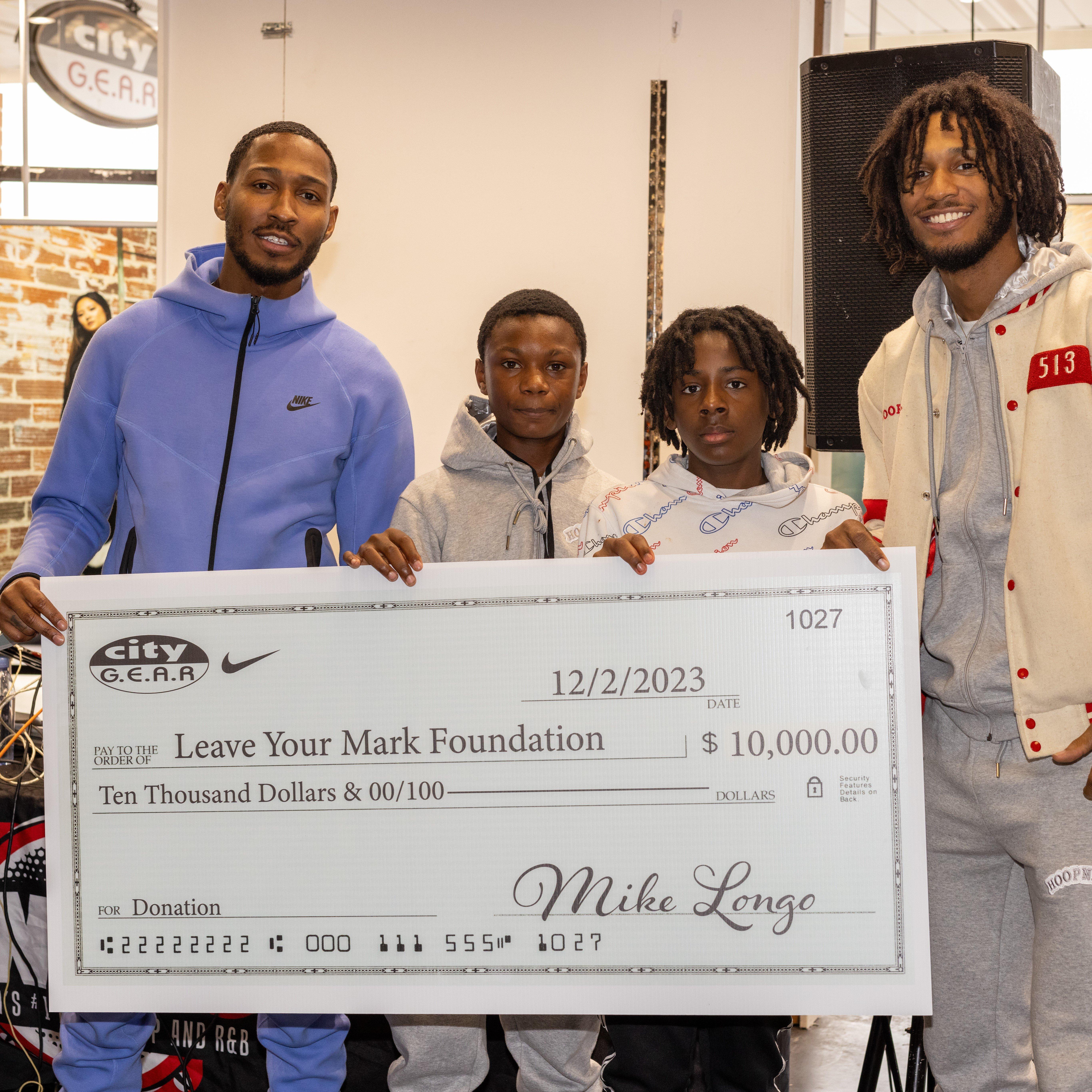 mark-dorris-with-community-giveback-check