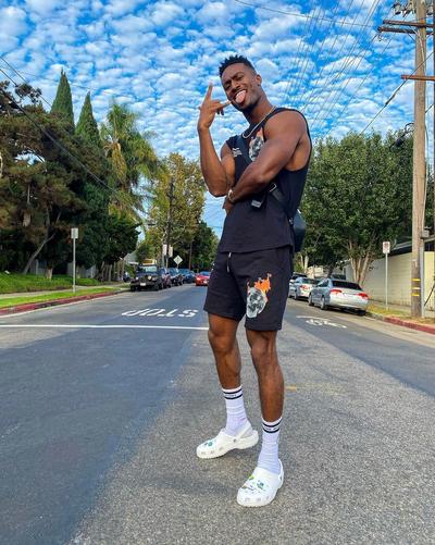 Retro Spirit - Man In Fit Wearing All White Crocs