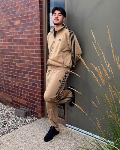 Man modeling monochromatic adidas look