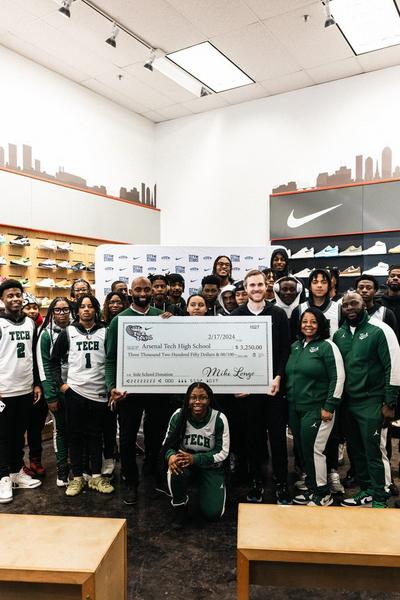 Myles Turner of the Indiana Pacers posing with Arsenal Tech High School students