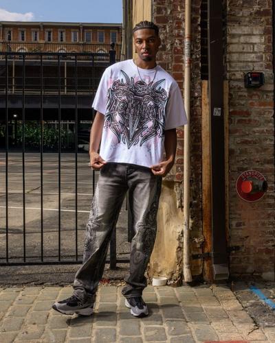 Man modeling New Balance sneakers