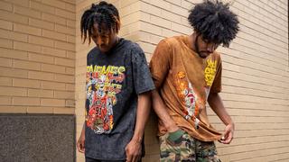 Men wearing Post Human brand graphic tees