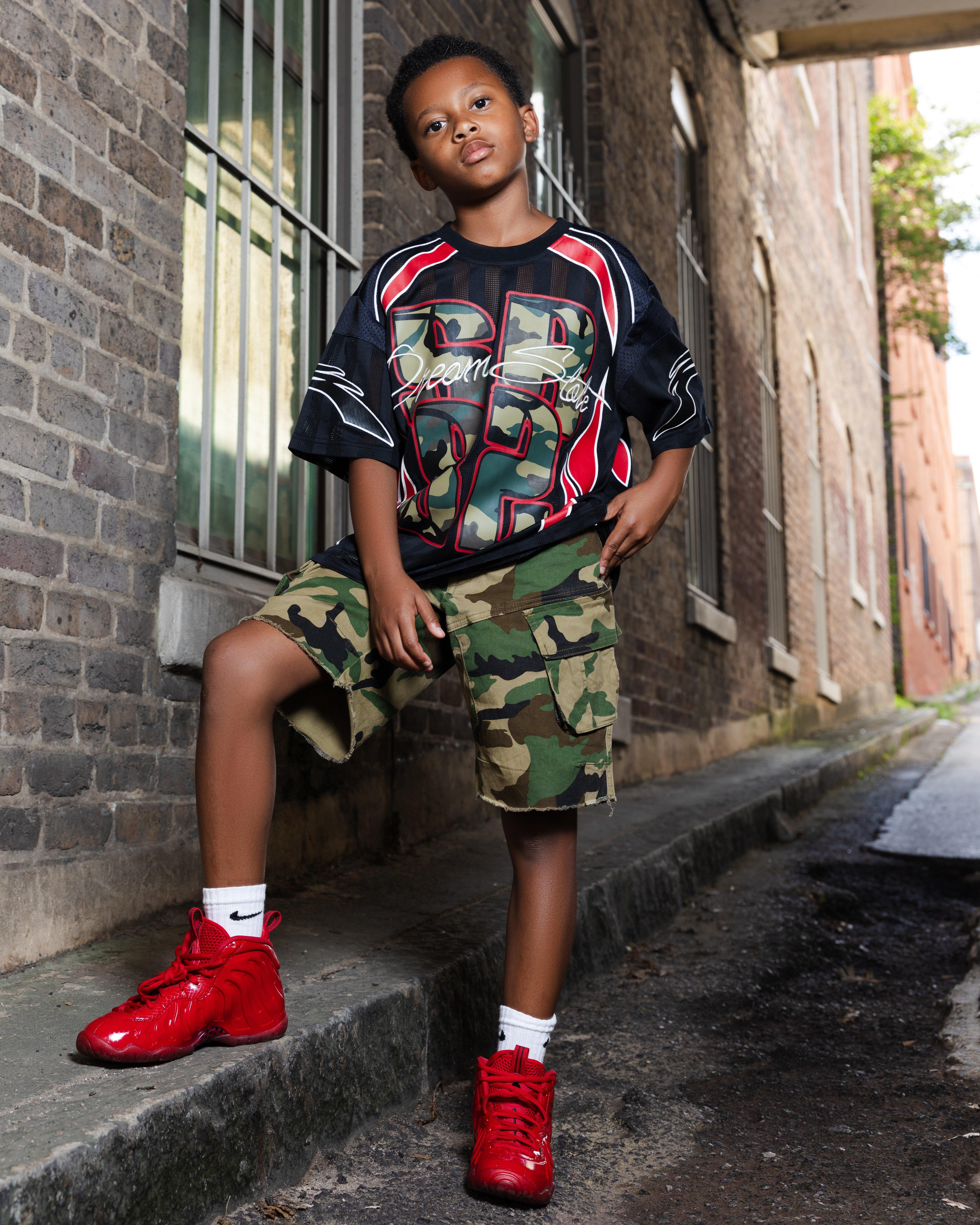 Nike Air Foamposite Pro "Gym Red" front view of shoe and boy in Smokerise apparel