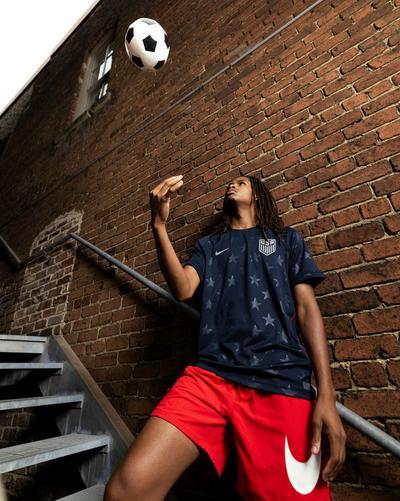 Man in Nike jersey and Nike Men's Swim Breaker 7" Volley Shorts 