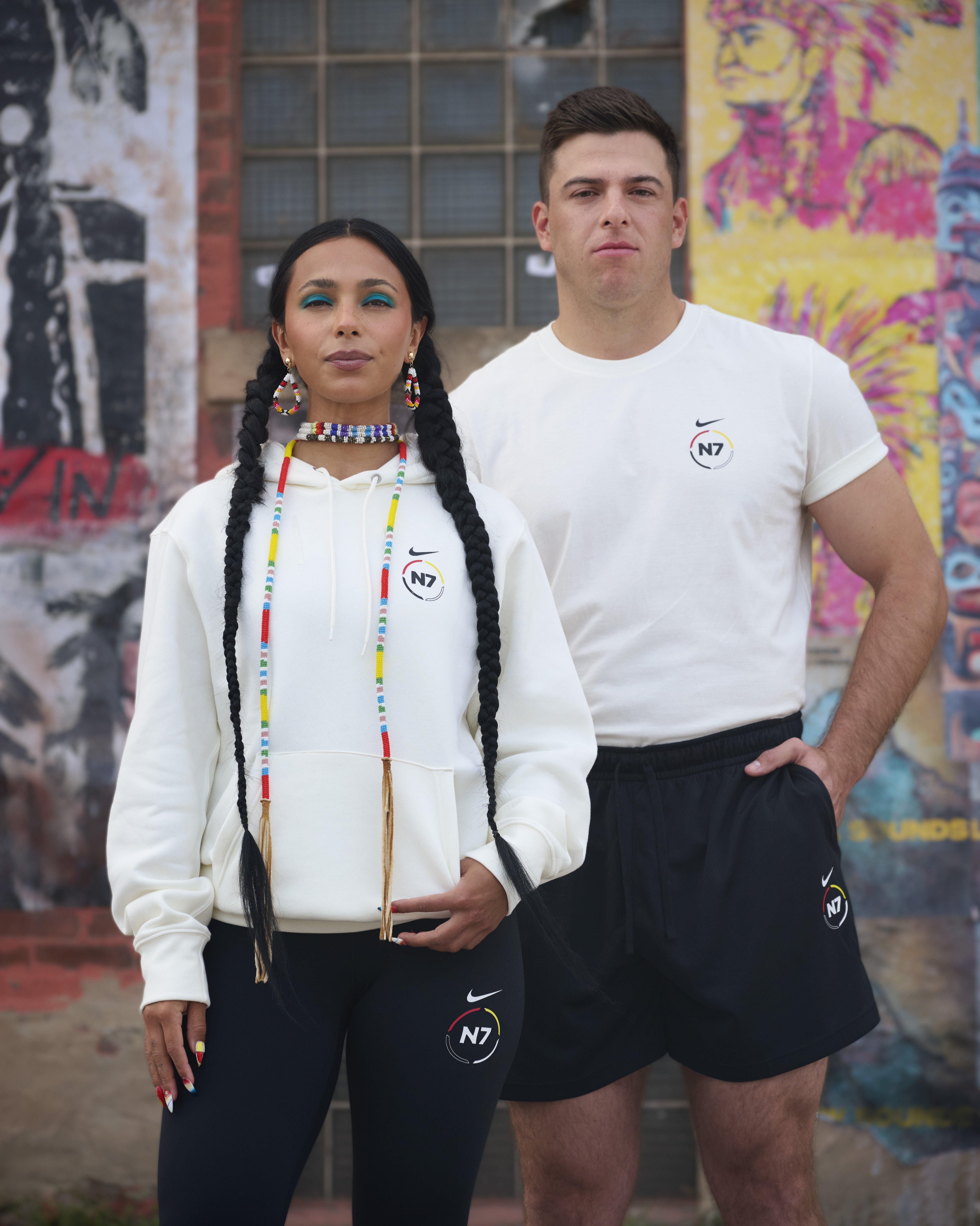 Man in Nike Sportswear N7 Crew-Neck T-Shirt and woman in Nike Club N7 Pullover Hoodie