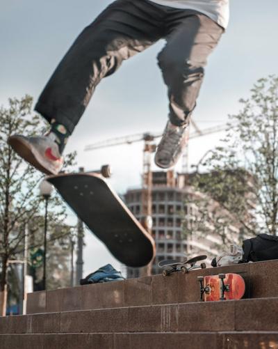 Man wearing Nike sneakers while skateboarding