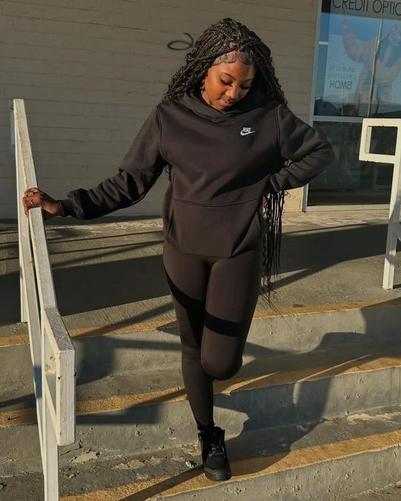 Woman wearing Nike Women's Sportswear Club Standard Fleece Pullover Hoodie