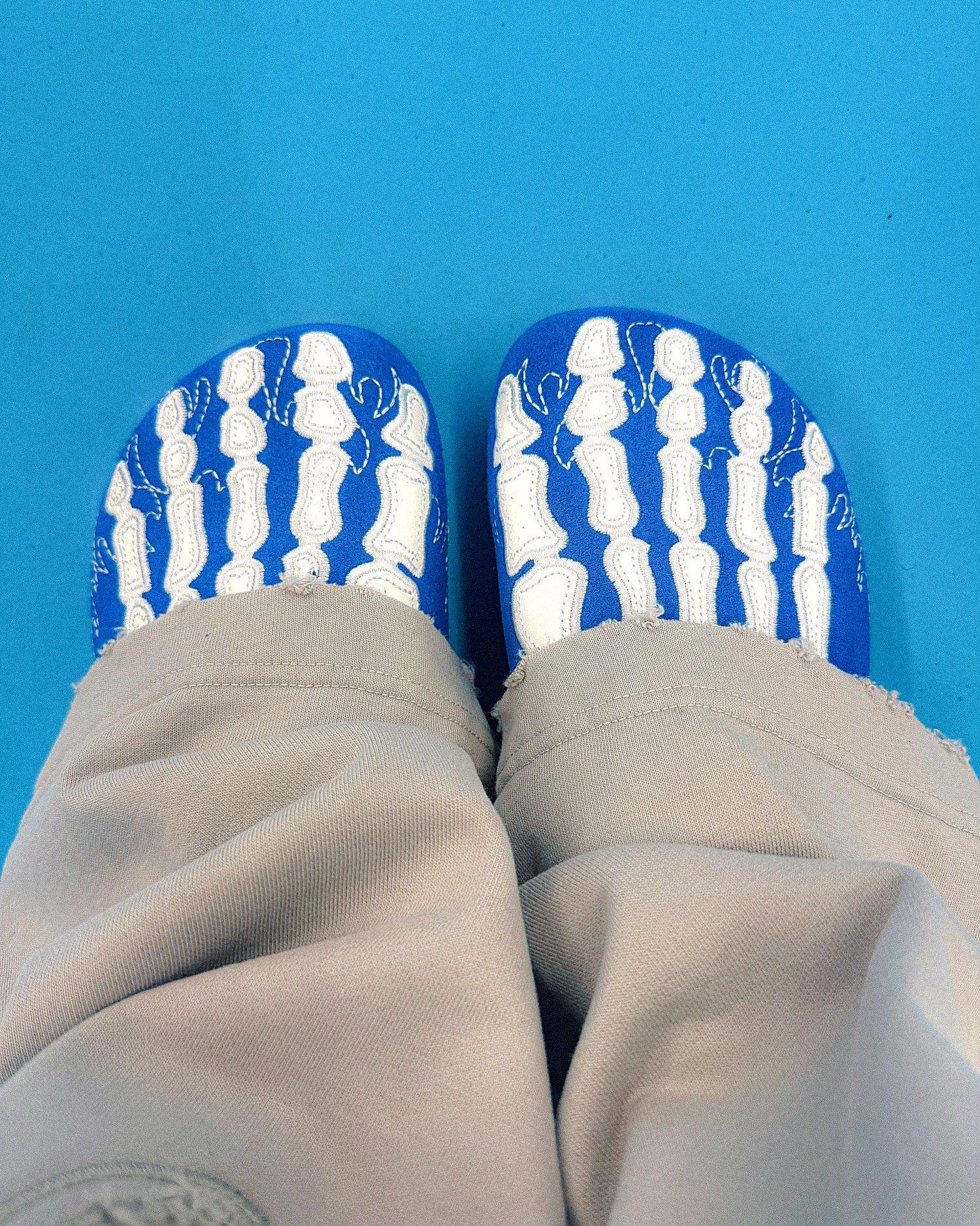 Jordan 1 High OG "UNC Reimagined" woman standing in sneakers