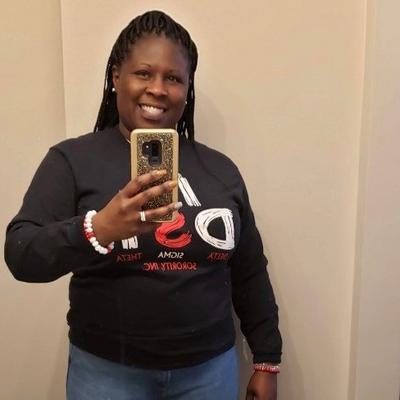 Pam Foley, DSM for City Gear taking cell phone selfie