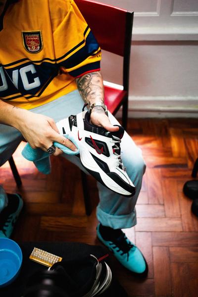 Getting Ready to Clean Your Sneakers - Man Cleaning Air Max Monarchs