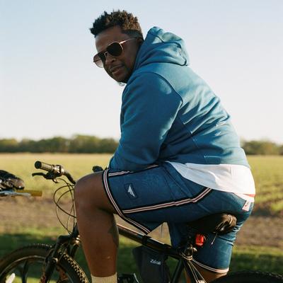 Reggie posing on a bicycle