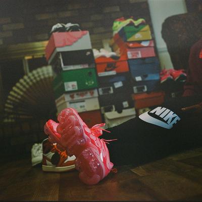 Close up of Nike Vapormax Plus outsoles on feet