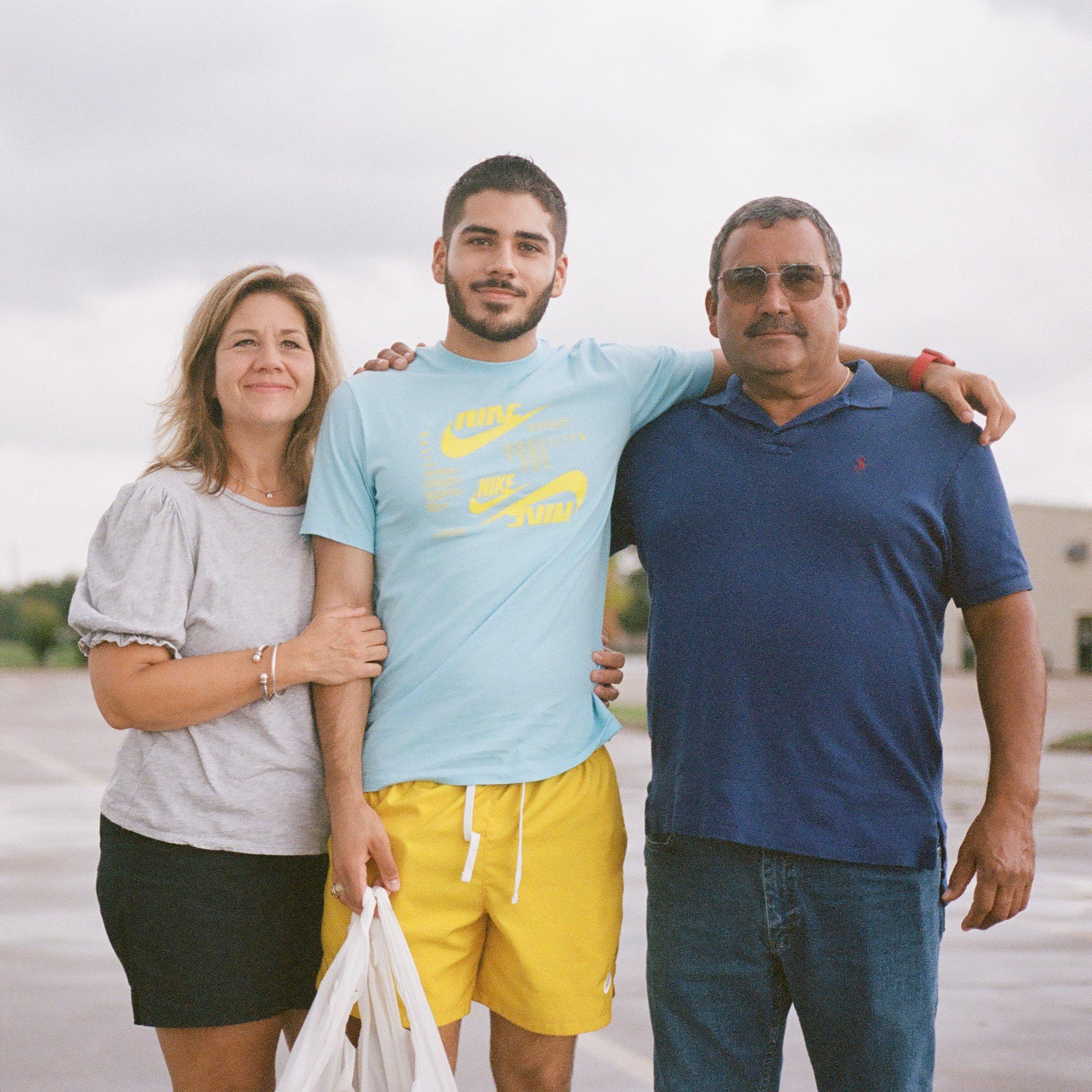 Gabe Vargas posing with parents in honor of Hispanic Heritage Month