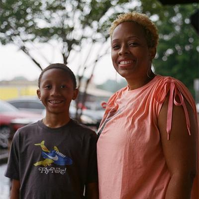 Rochelle Sullivan and son smiling at camera