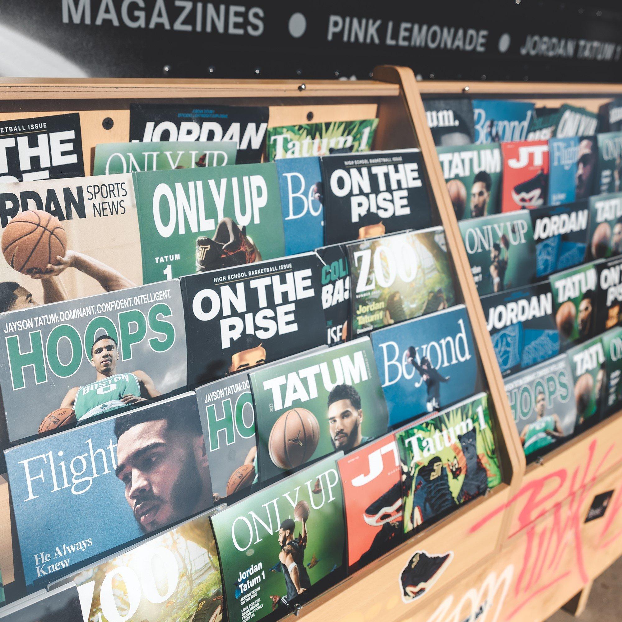 News stand outside Tatum Truck featuring Jayson Tatum editorial covers