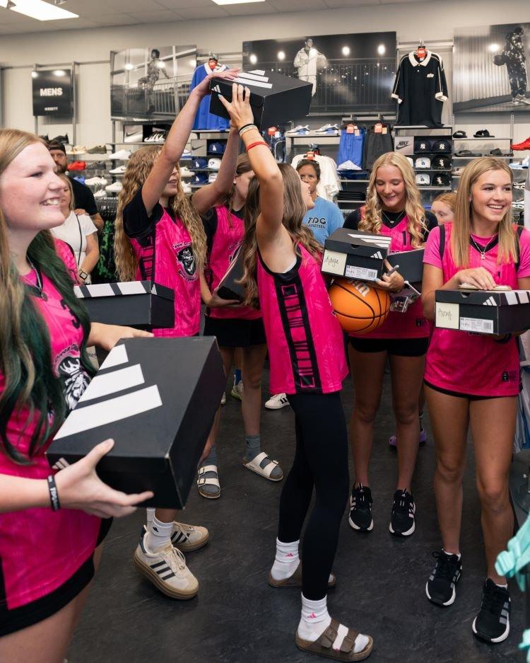 team-members-of-team-dream-receiving-sophie-cunningham-pe-sneakers