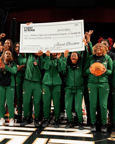 Huffman High School&rsquo;s boys and girls basketball programs with $50K donation check.