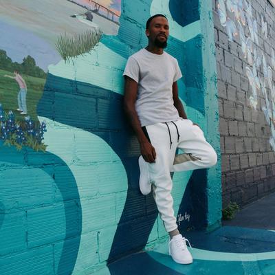 STSH Tony Williams posing against Baytown street mural