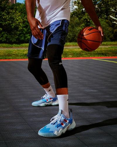 Man dribbling wearing Trae Young shoes