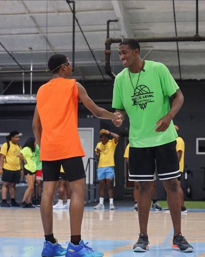 Trey Jemison shaking younger players hand