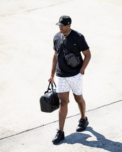 Trey Jemison Walking Carrying Black Duffle