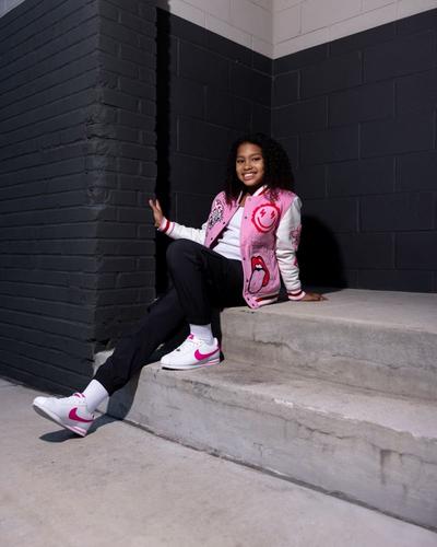 Girl modeling Varsity jacket