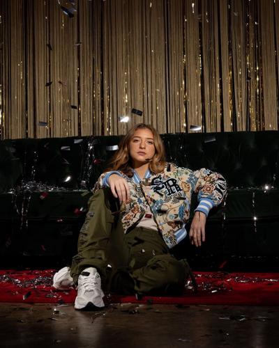 Woman modeling Varsity Jacket