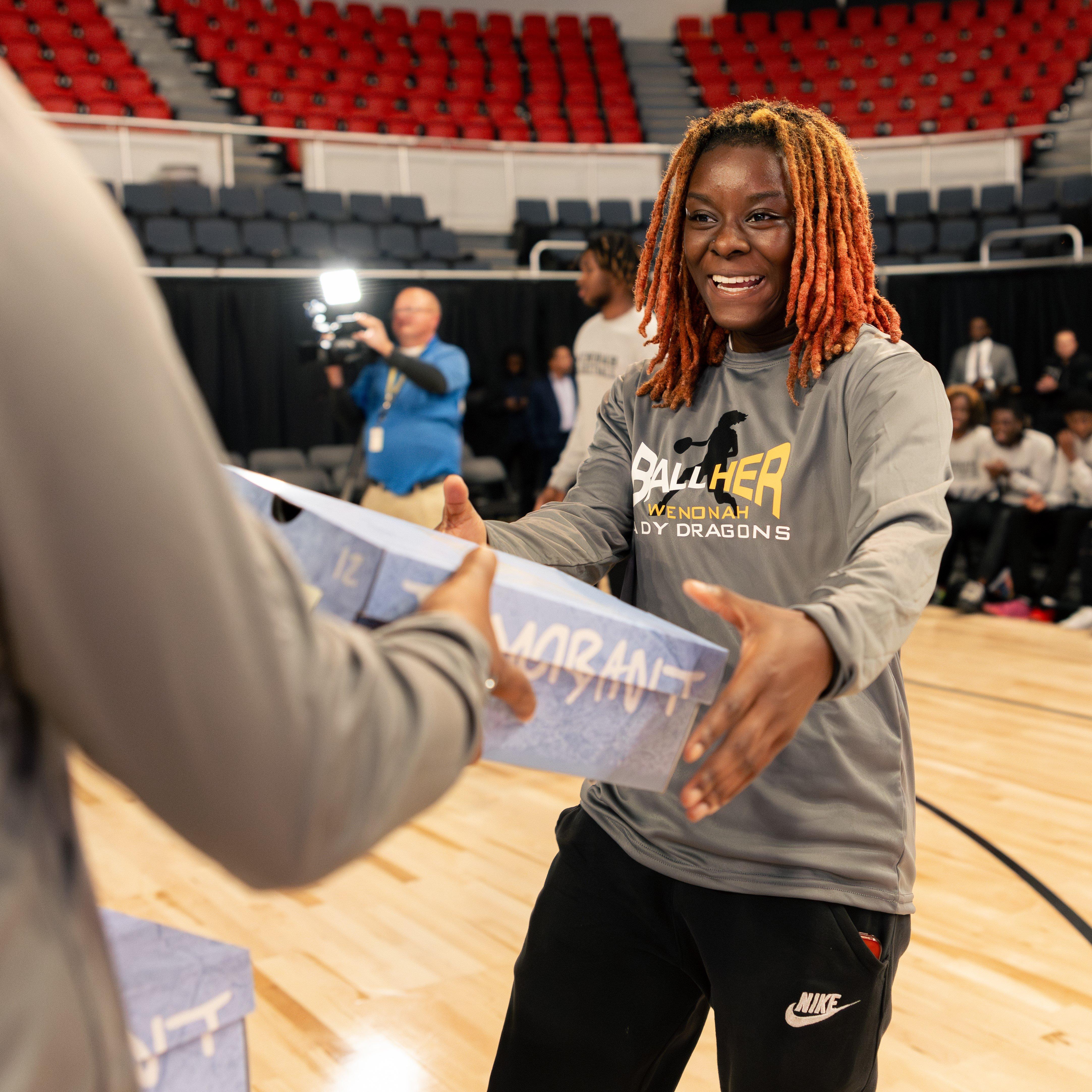 wenonah-hs-womens-basketball-player-receiving-new-ja-basketball-shoes