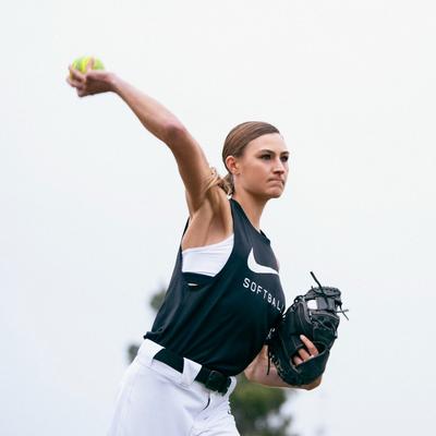 Softball Gloves and Mitts - Woman throwing softball with glove