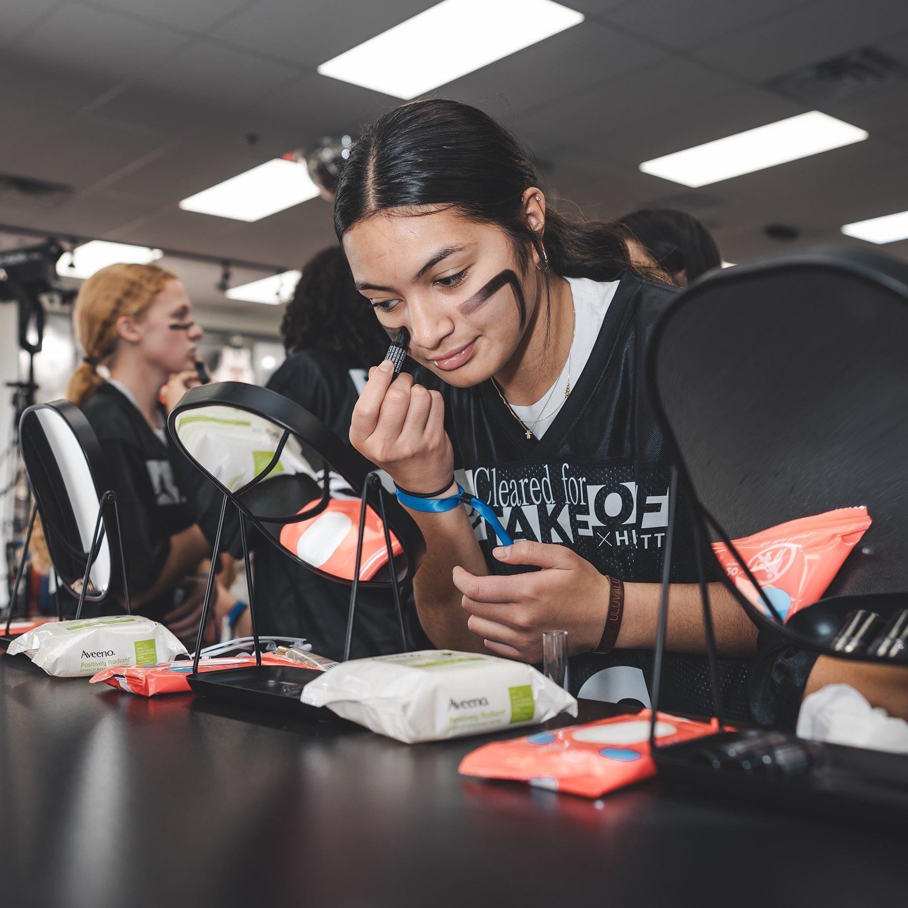 women-at-cleared-for-takeoff-event-getting-eye-black