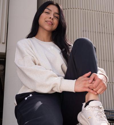 Women's Under Armour crewneck and Hoka sneakers