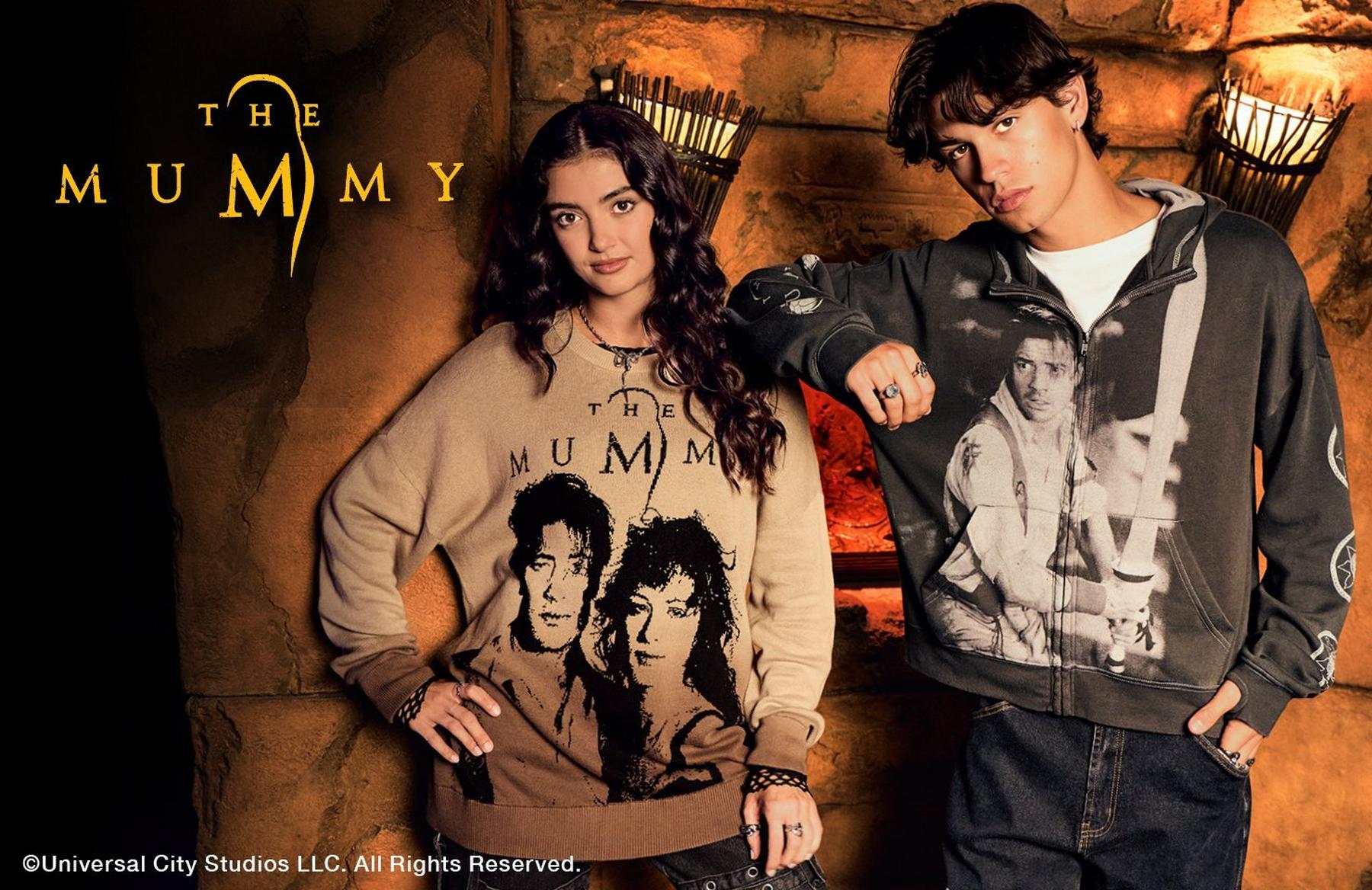 Two models wearing The Mummy graphic sweatshirt and zip hoodie. Shop Now.