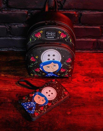 Coraline mini backpack and matching wristlet wallet with character and button-eye design. Shop Now.