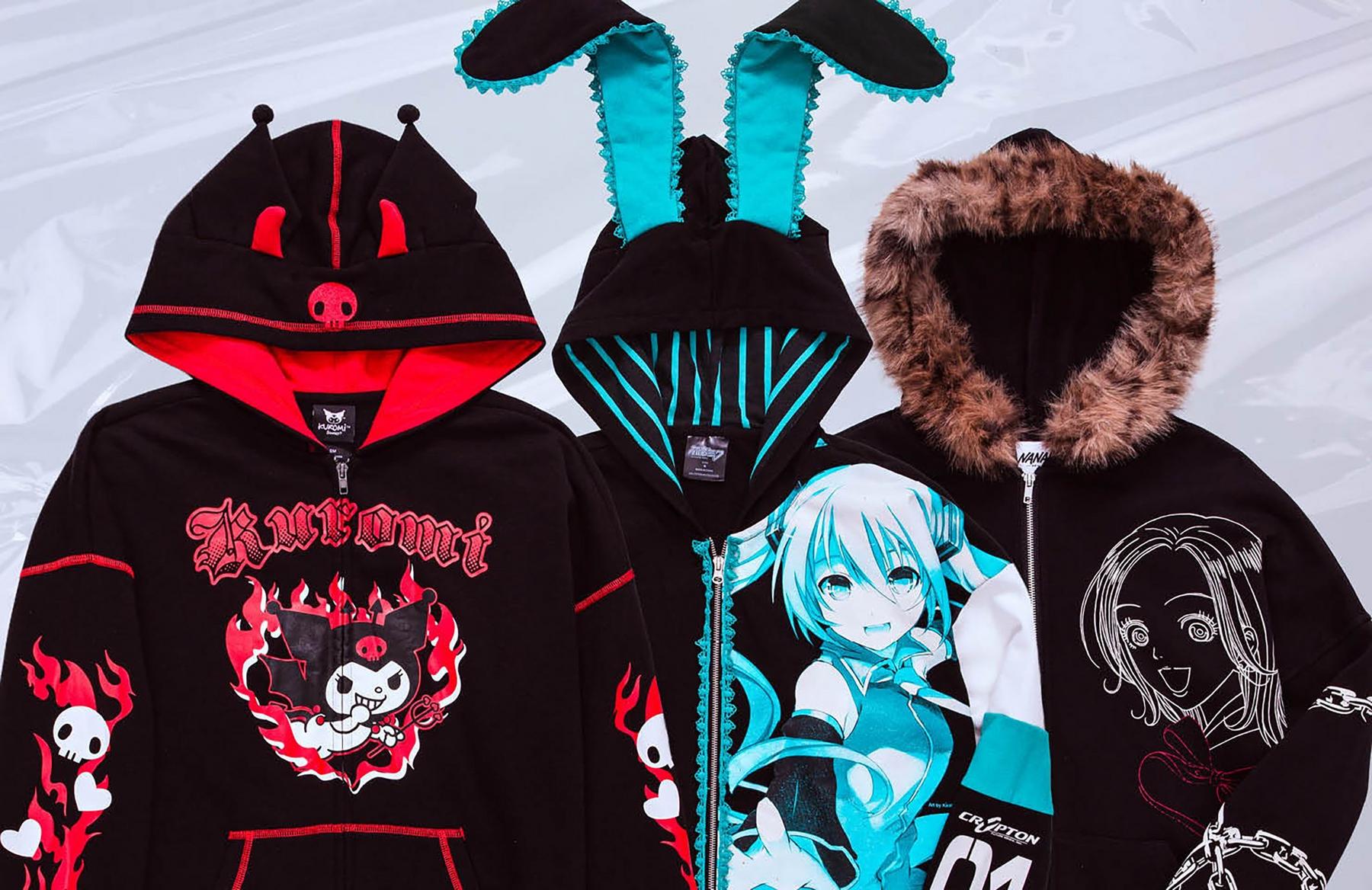 Three black graphic hoodies with character prints, including bunny ears and a faux-fur hood. Shop Now.