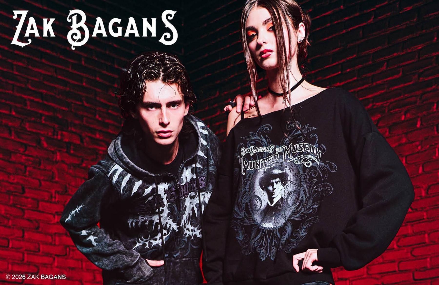 Model wearing Silent Hill “Enter the Fog” sweatshirt with character graphic and sleeve patches. Shop Now.