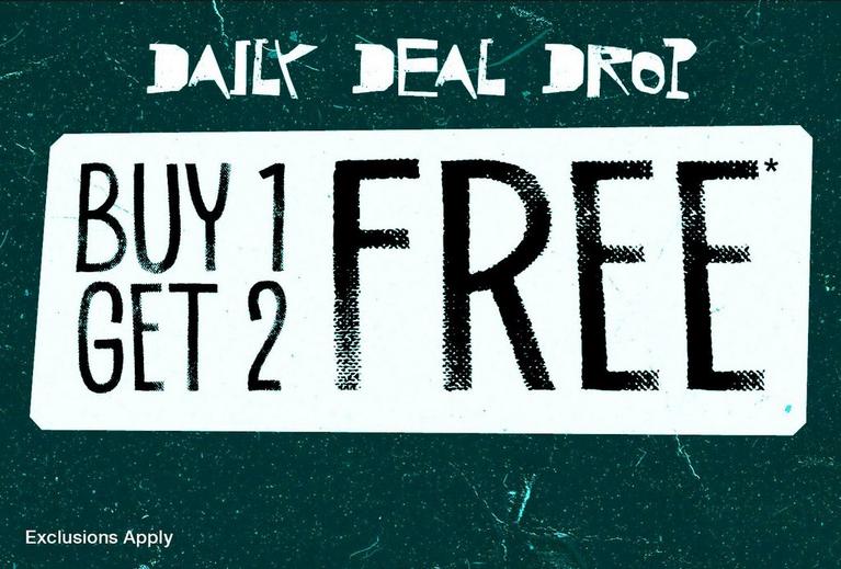 Promotional graphic reading “Daily Deal Drop” and “Buy 1 Get 2 Free*”. Shop Now.