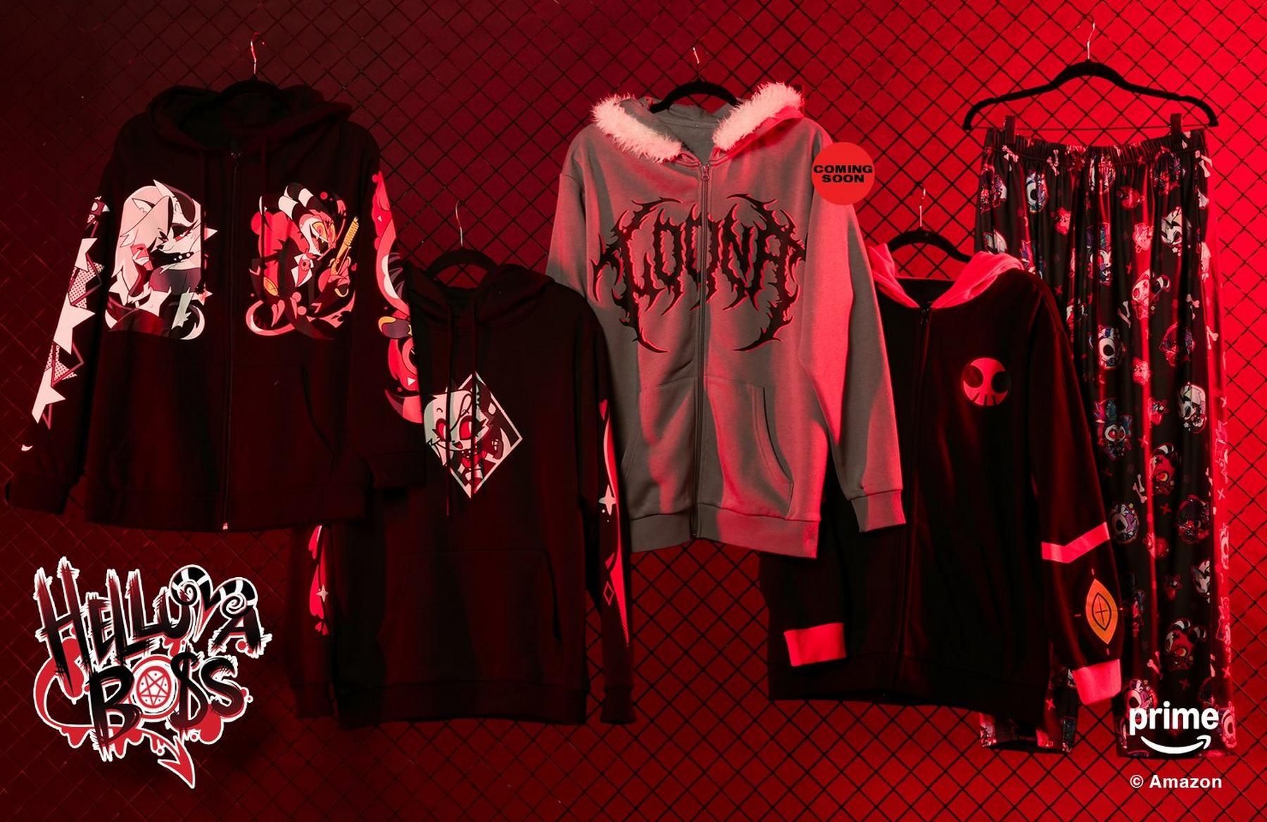 Helluva Boss hoodies, zip hoodie, and pajama pants hanging on a chain-link fence display. Shop Now.