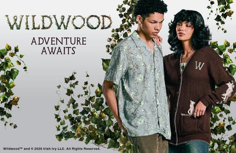 Wildwood “Adventure Awaits” ad with two models wearing patterned shirt and W cardigan. Shop Now.
