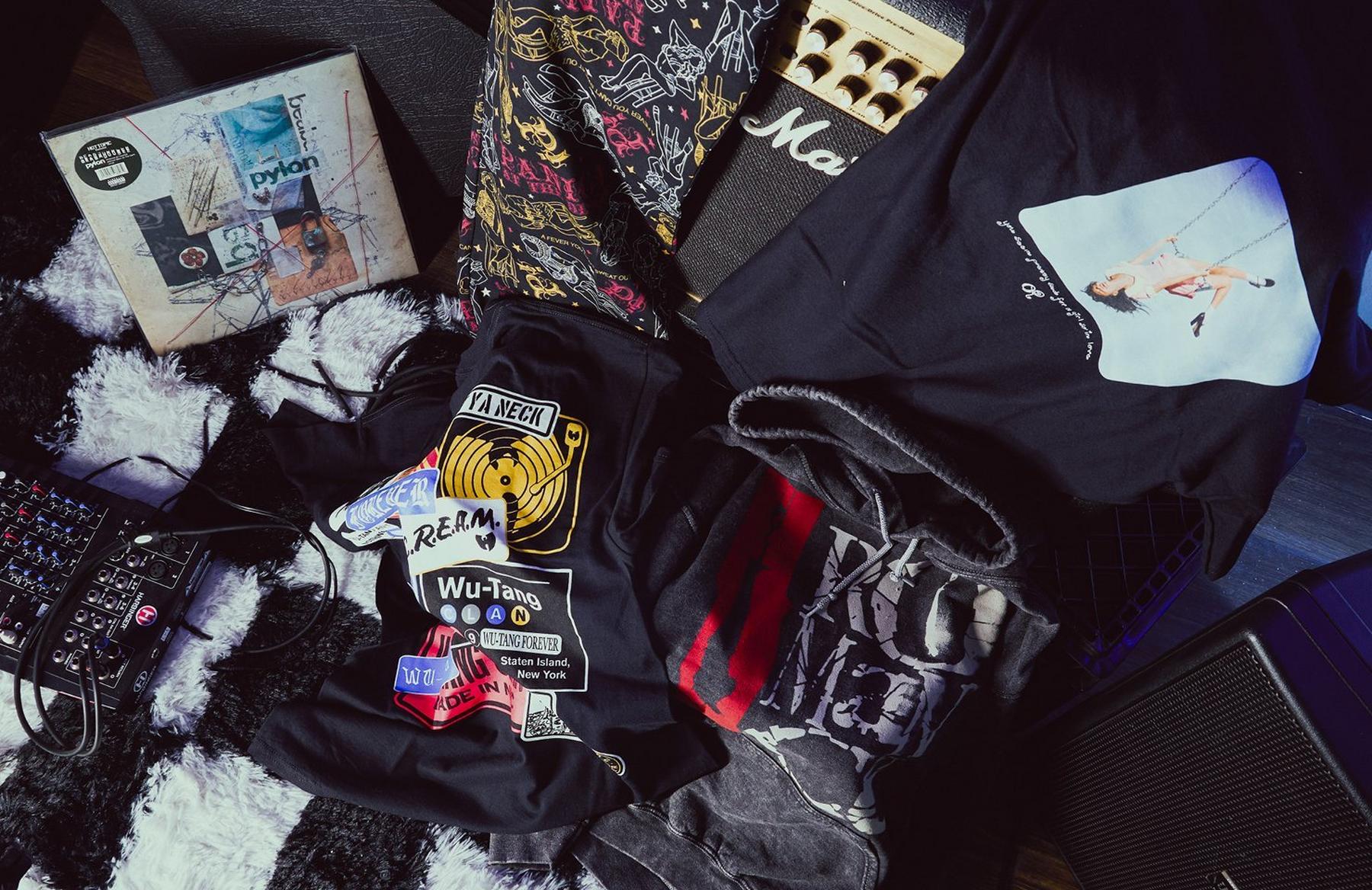 Assorted graphic hoodies and shirts with music gear and a vinyl record. Shop Now.