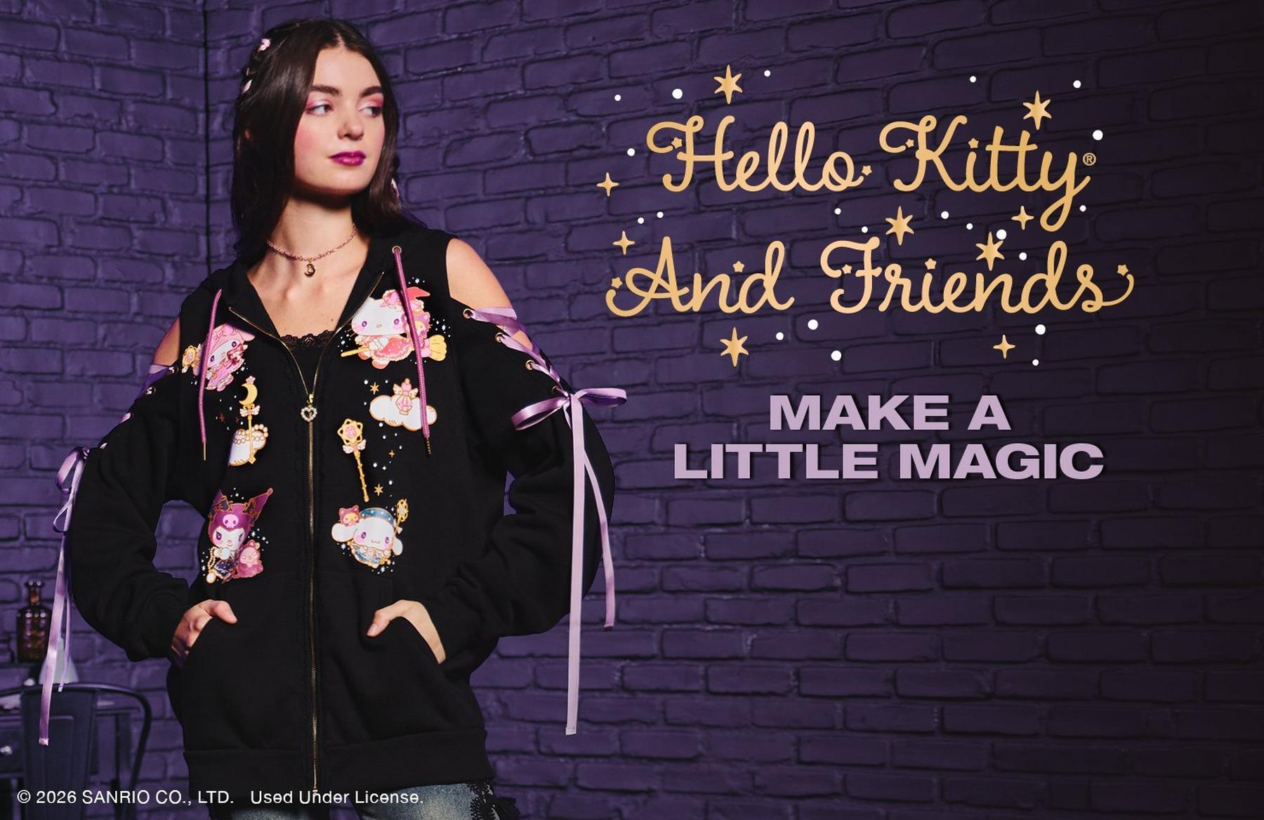 Model wearing Hello Kitty and Friends black zip hoodie with character print and ribbon sleeves. Shop Now.