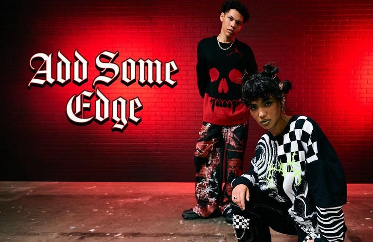 Two models pose in edgy streetwear; text reads “Add Some Edge”. Shop Now.