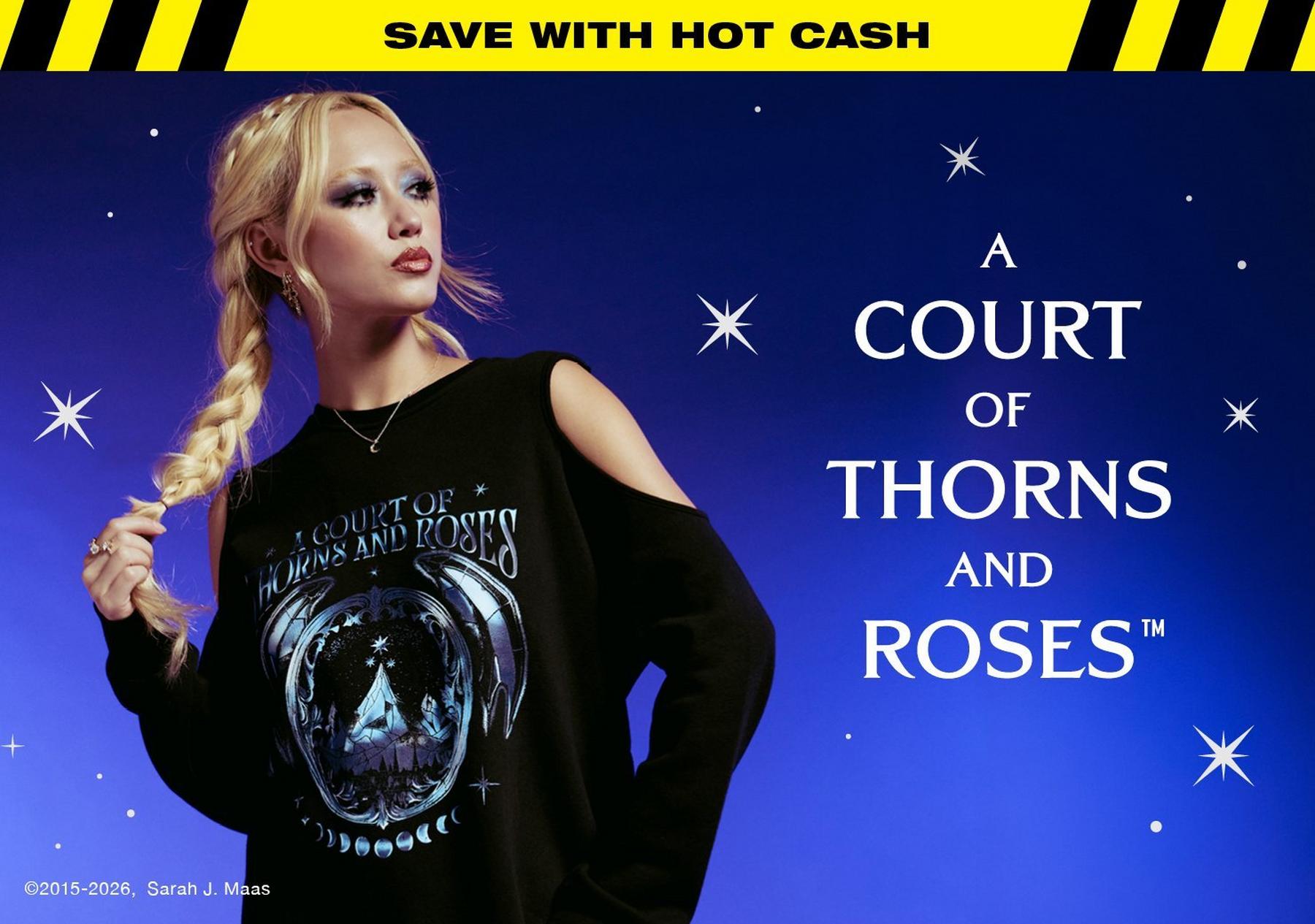 Model wearing an off-shoulder “A Court of Thorns and Roses” graphic sweatshirt. Shop Now.