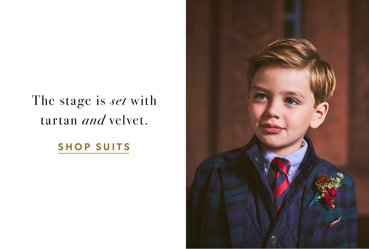 The stage is set with tartan and velvet. Shop Suits.