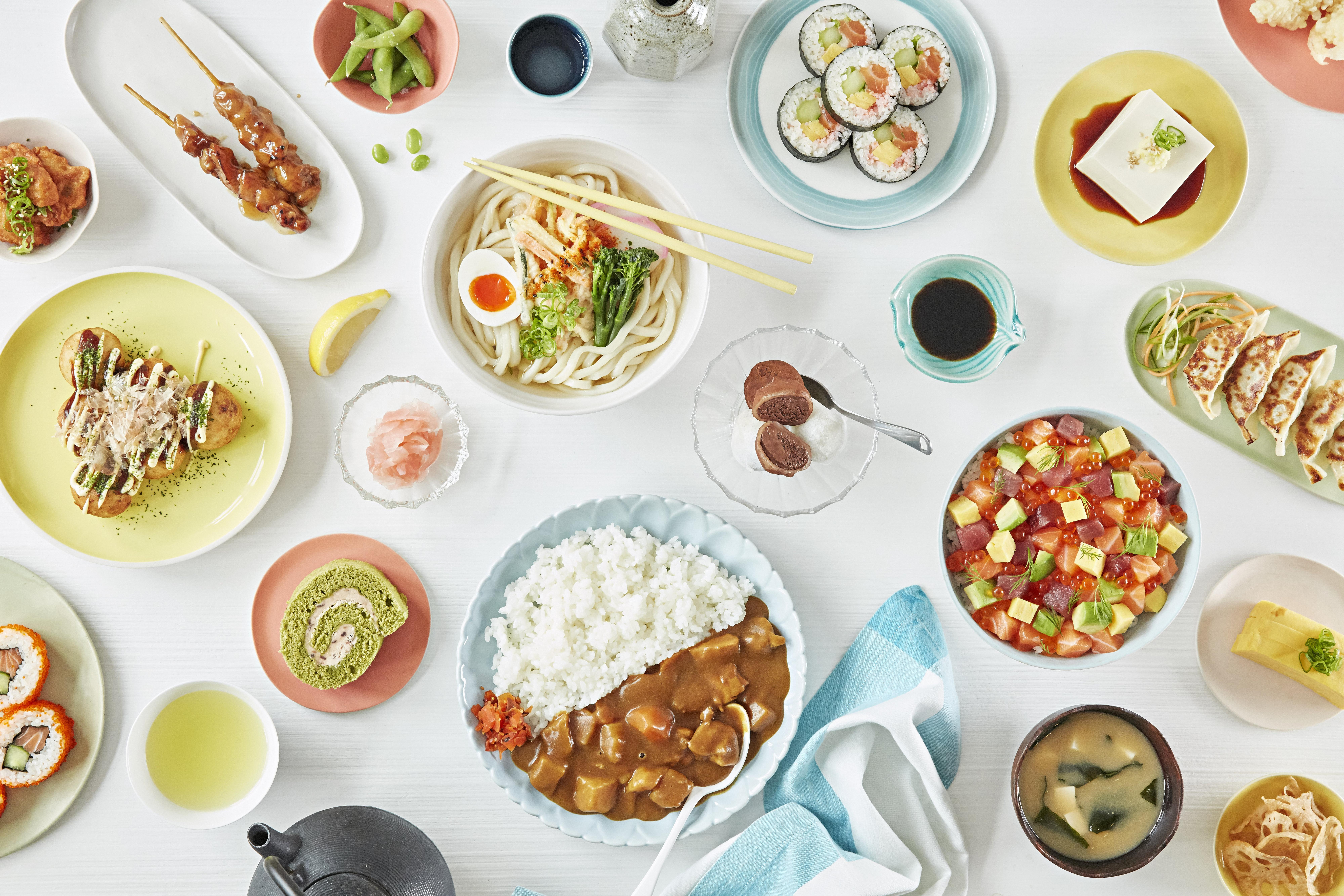 Many Japanese dishes on a table